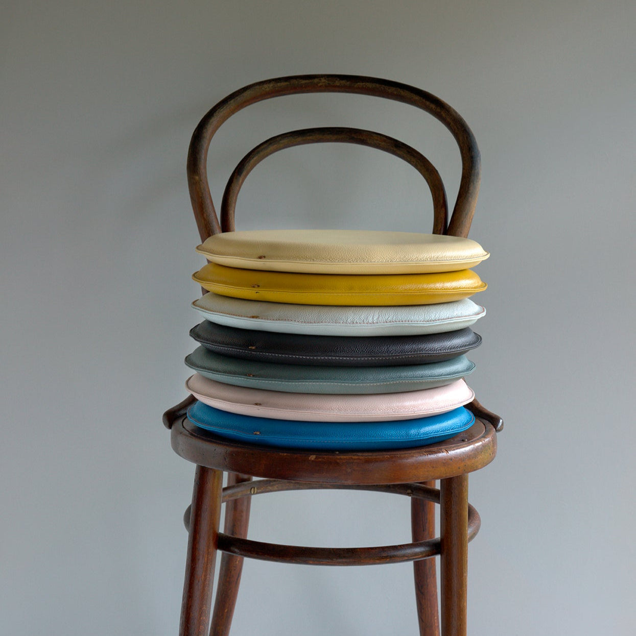 Stack of Round leather seat (seat cushion) on chair